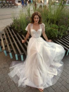 A bride in a whimsical tulle gown with a sweetheart neckline and lace bodice, exuding the sophistication of modern wedding dresses Toronto.