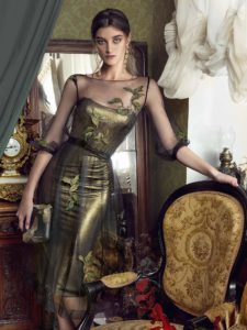 Style #443, A form-fitting cocktail dress with A-line overlay and three-quarter sleeves, available in gold-black