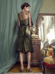 Style #443, A form-fitting cocktail dress with A-line overlay and three-quarter sleeves, available in gold-black