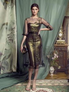 Style #443, A form-fitting cocktail dress with A-line overlay and three-quarter sleeves, available in gold-black