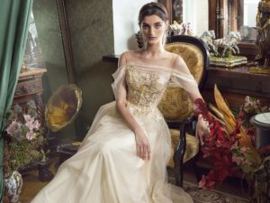 Style #477, A-line evening gown with off-the-shoulder sleeves, available in black, ivory