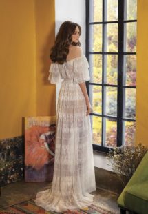 Style #2023L, lace wedding dress with ruffled bell sleeves, available in ivory on a nude base, ivory