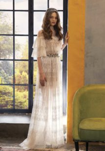 Style #2023L, lace wedding dress with ruffled bell sleeves, available in ivory on a nude base, ivory