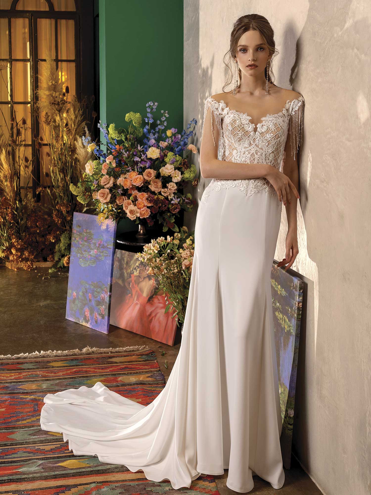 Style #2030L, fit and flare wedding dress with fringe, available in ivory