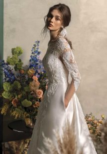 Style #2017L, long sleeved ball gown wedding dress with pockets, available in ivory