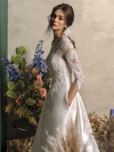 Long sleeved ball gown wedding dress with pockets