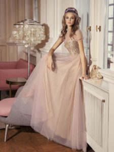 Style #501, A-line evening gown with cap sleeves and embellished bodice, available in ivory-nude, powder