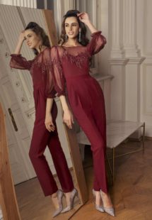Style #509-8, jumpsuit with bishop sleeves and zig zag embroidery, available in black, powder, burgundy, ivory