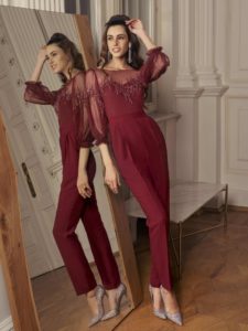 Style #509-8, jumpsuit with bishop sleeves and zig zag embroidery, available in black, powder, burgundy, ivory