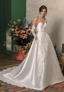 Style #2017L, long sleeved ball gown wedding dress with pockets, available in ivory