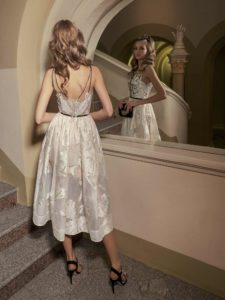 Style #536, midi dress with plunging neckline, and spaghetti straps, available in ivory