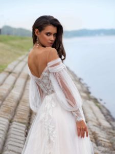 Style #12060, wedding dress with off-the-shoulder bishop sleeves, available in ivory, ivory-nude