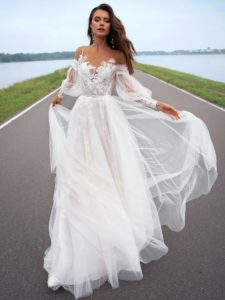 Wedding dress with off-the-shoulder bishop sleeves, available in ivory, ivory-nude