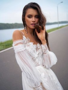 Wedding dress with off-the-shoulder bishop sleeves, available in ivory, ivory-nude