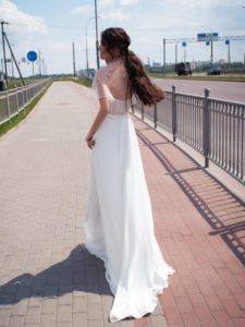 Simple wedding dress with plunging neckline and pearl decor