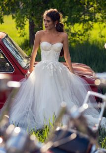 Style #12063, wedding dress with bustier bodice and floral embroidery, available in ivory