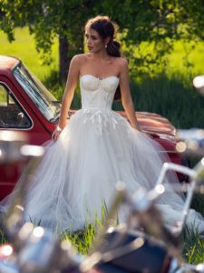 Wedding dress with bustier bodice and floral embroidery