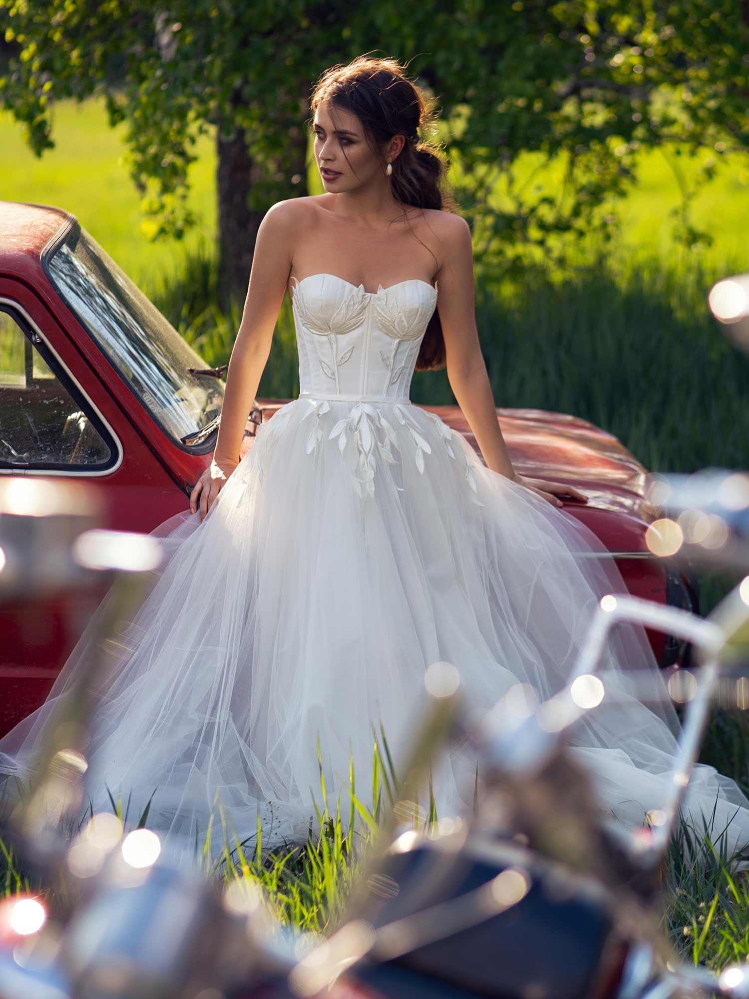 Style #12063, wedding dress with bustier bodice and floral embroidery, available in ivory