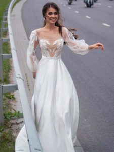 Wedding gown with embroidery and bishop sleeves, available in ivory, ivory-nude