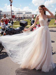 A-line wedding dress with spaghetti straps and embroidered lace, available in ivory, ivory-nude