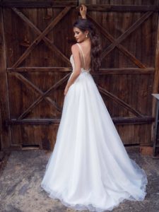 Modern wedding dress with floral applique and low back, available in ivory, ivory-nude