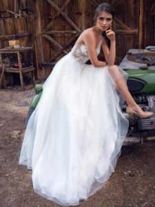 Modern wedding dress with floral applique and low back, available in ivory, ivory-nude