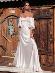 Off-the-shoulder wedding dress with bishop sleeves
