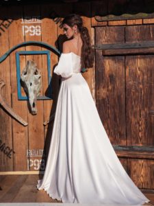 Off-the-shoulder wedding dress with bishop sleeves