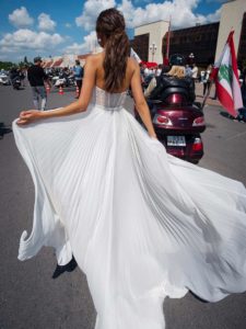 Simple modern wedding dress with strapless bodice, available in ivory, ivory-nude