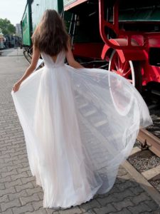 A-line bridal gown with a plunging neckline, available in ivory, dark ivory