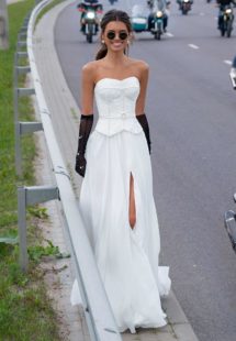 Style #12083, simple wedding dress with dropped waist and pearl details, available in ivory