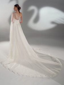 A-line wedding dress with one-shoulder cape sleeve