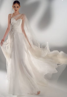 Style #2101, A-line wedding dress with one-shoulder cape sleeve, available in ivory