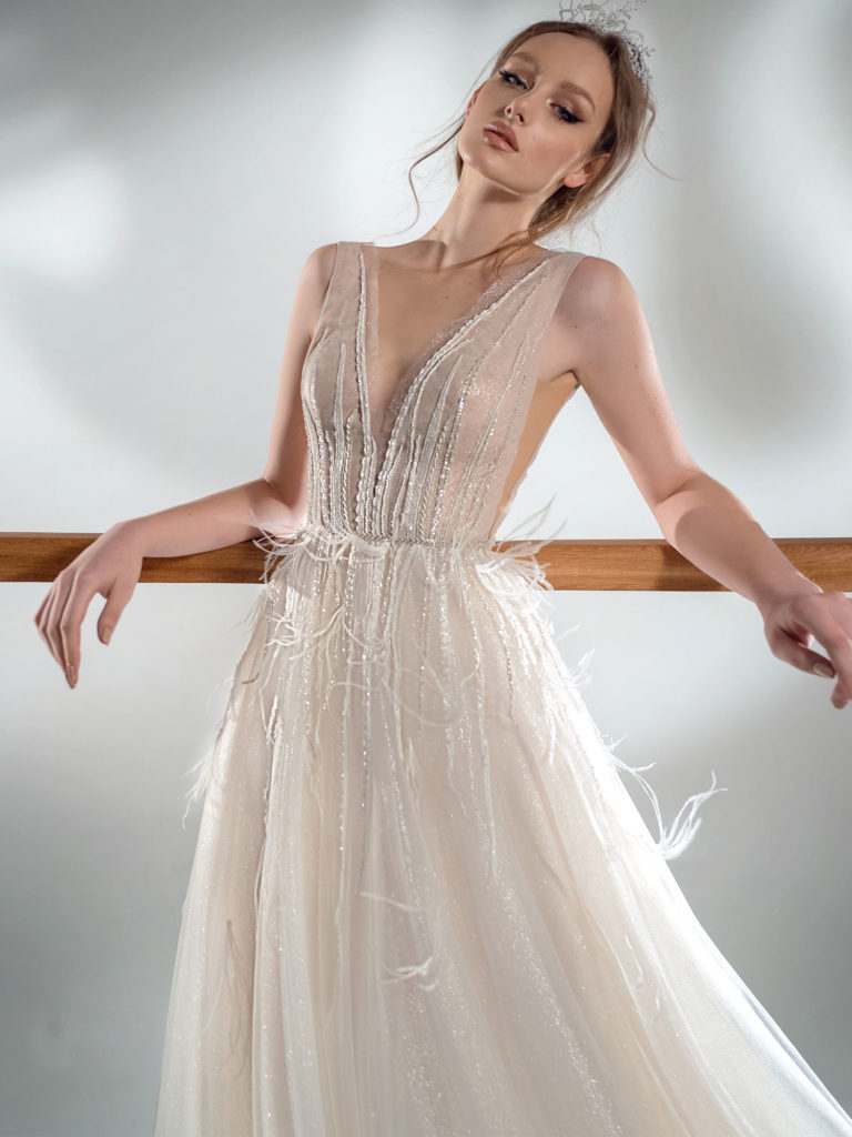 Style #2103, sparkling A-line wedding dress with V-neckline, available in ivory-nude, ivory