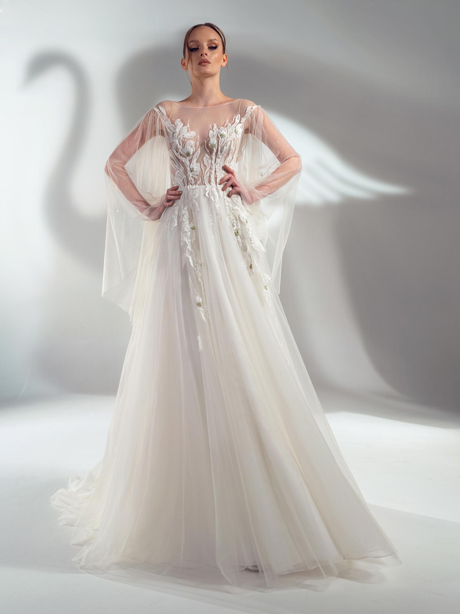 Style #2107, cape sleeve A-line wedding dress with floral applique, available in ivory-nude, ivory (lace is possible only as in the photo)
