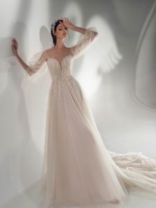 Style #2110, sparkly A-line wedding dress with off-the-shoulder sleeves, available in cream, ivory