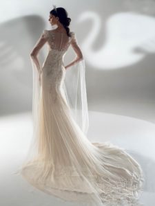 Fit and flare wedding dress with long bell sleeves, available in cream, ivory