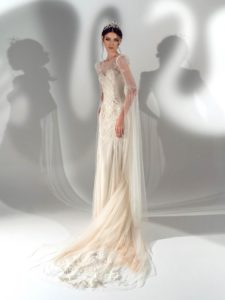 Style #2112, fit and flare wedding dress with long bell sleeves, available in cream, ivory