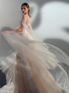 A-line wedding dress with cape sleeves, available in cream, ivory