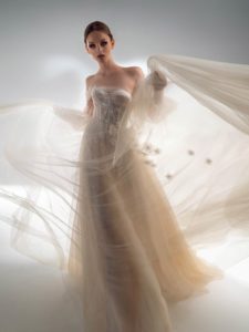 Off the shoulder A-line wedding dress with detachable sleeves, available in cream–nude, ivory