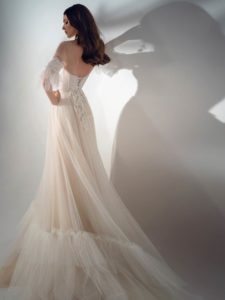 Three-quarter sleeve A-line wedding dress with ruffles, available in cream-nude, ivory