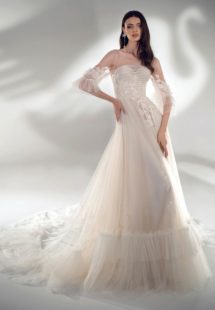 Style #2122, three-quarter sleeve A-line wedding dress with ruffles, available in cream-nude, ivory