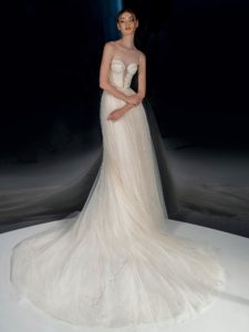 Cream sparkly A-line wedding dress with bustier top