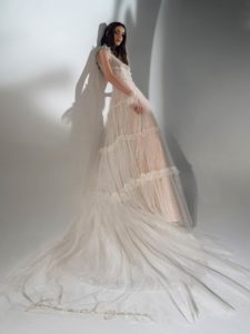 Shimmering A-line wedding dress with ruffles, available in ivory-nude, ivory
