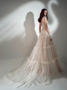 Shimmering A-line wedding dress with ruffles, available in ivory-nude, ivory
