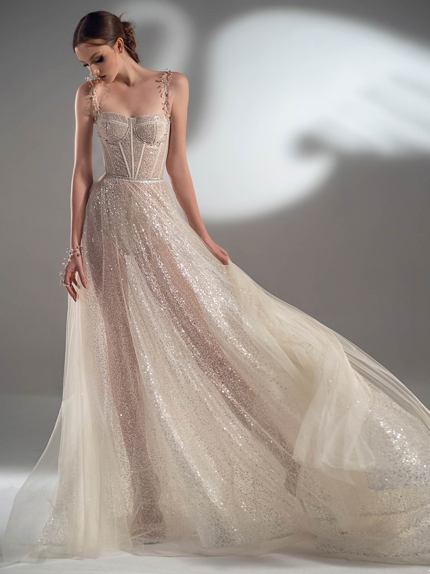 Style #2133, sparkle A-line wedding dress with spaghetti straps, available in nude-ivory, ivory