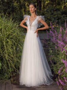 White glitter tulle A-line wedding dress with ruffled cap sleeves and open back
