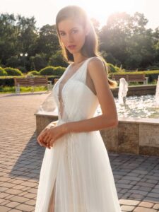 Sleeveless A-line wedding dress with a unique plunging neckline