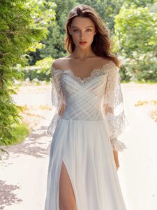 Off the shoulder sheath wedding dress with lace bishop style sleeves; available in ivory-nude, ivory, white