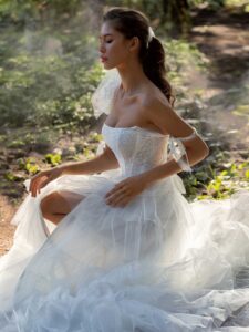 Shimmering ball gown with textured skirt and high slit